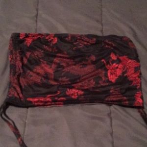 This is A belly crop top design with dragons this is a largeStrings coming down